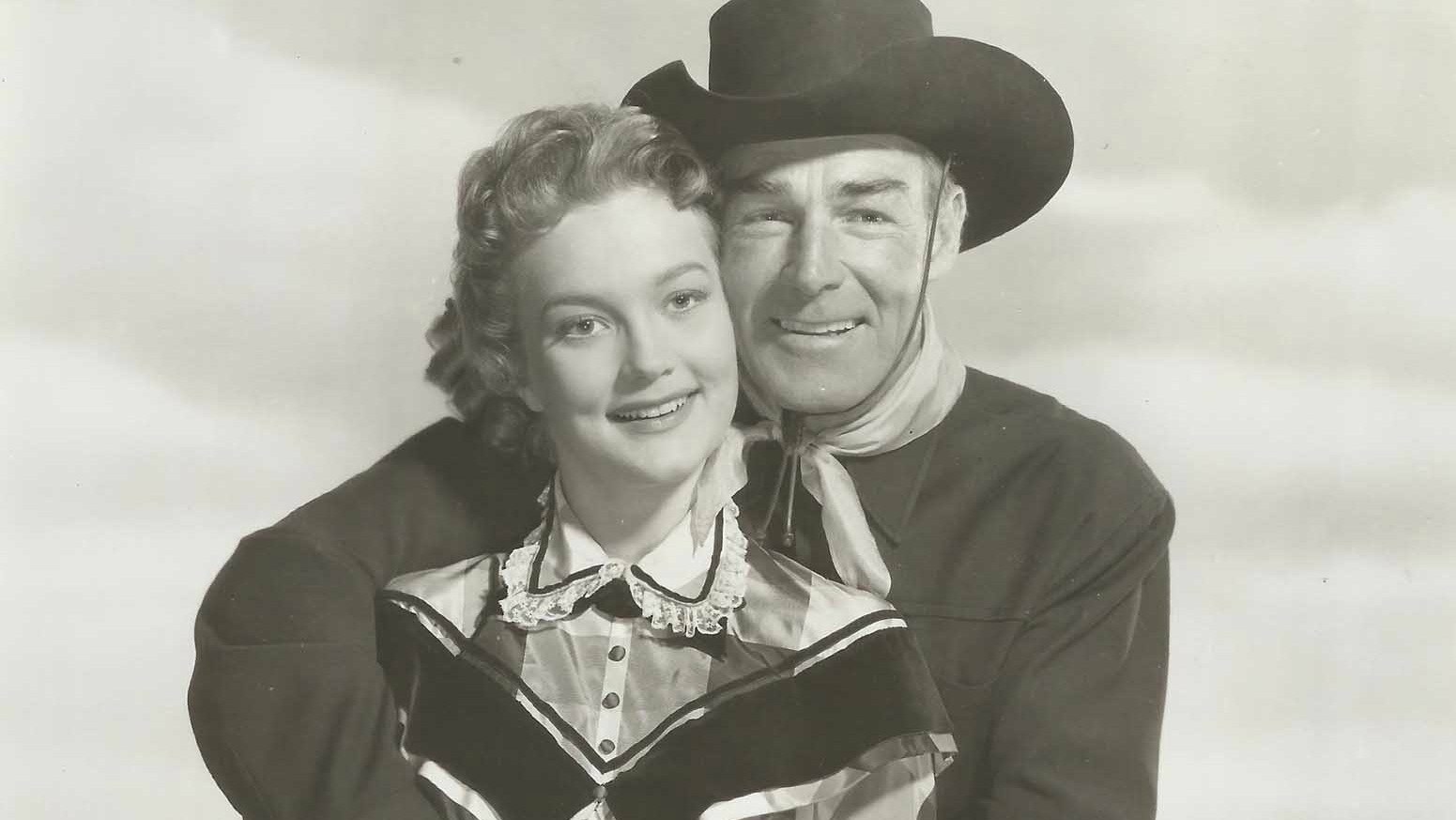 Backdrop for The Man Behind The Gun