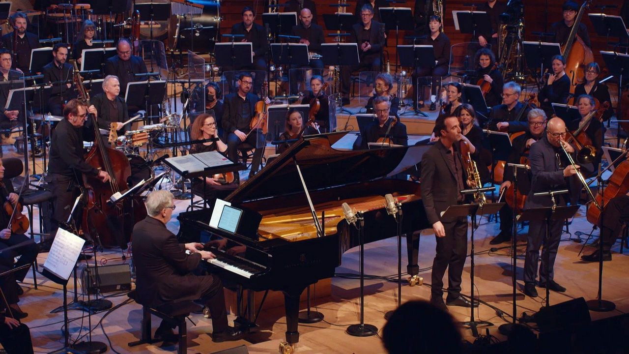 Backdrop for Lalo Schifrin, Mission: Impossible - Conducted by Victor Jacob