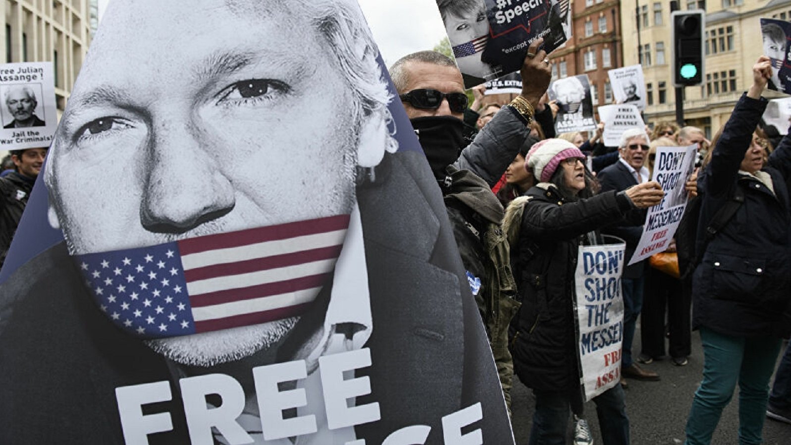 Backdrop for The War on Journalism: The Case of Julian Assange