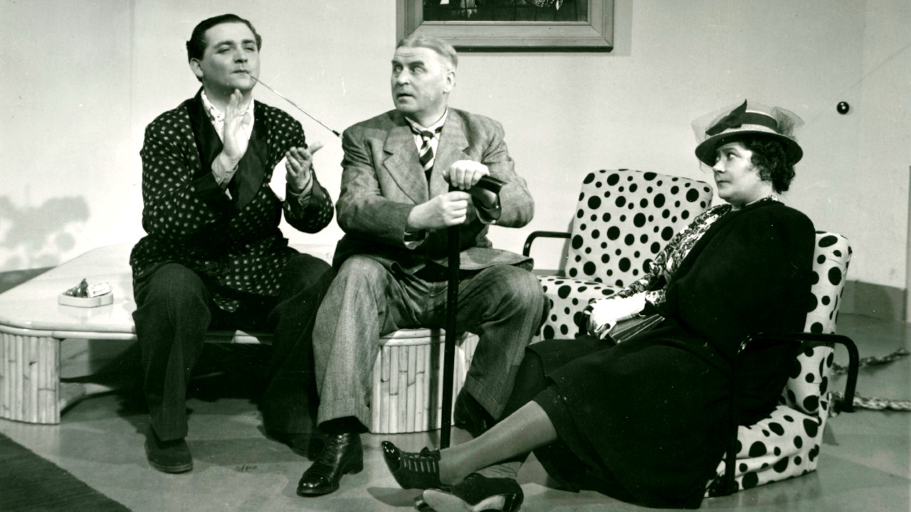 Backdrop for En fattig miljonär