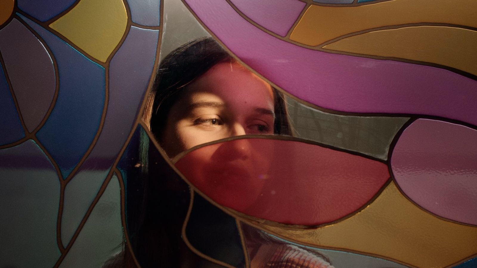 Backdrop for Cracks run through this multicolored glass