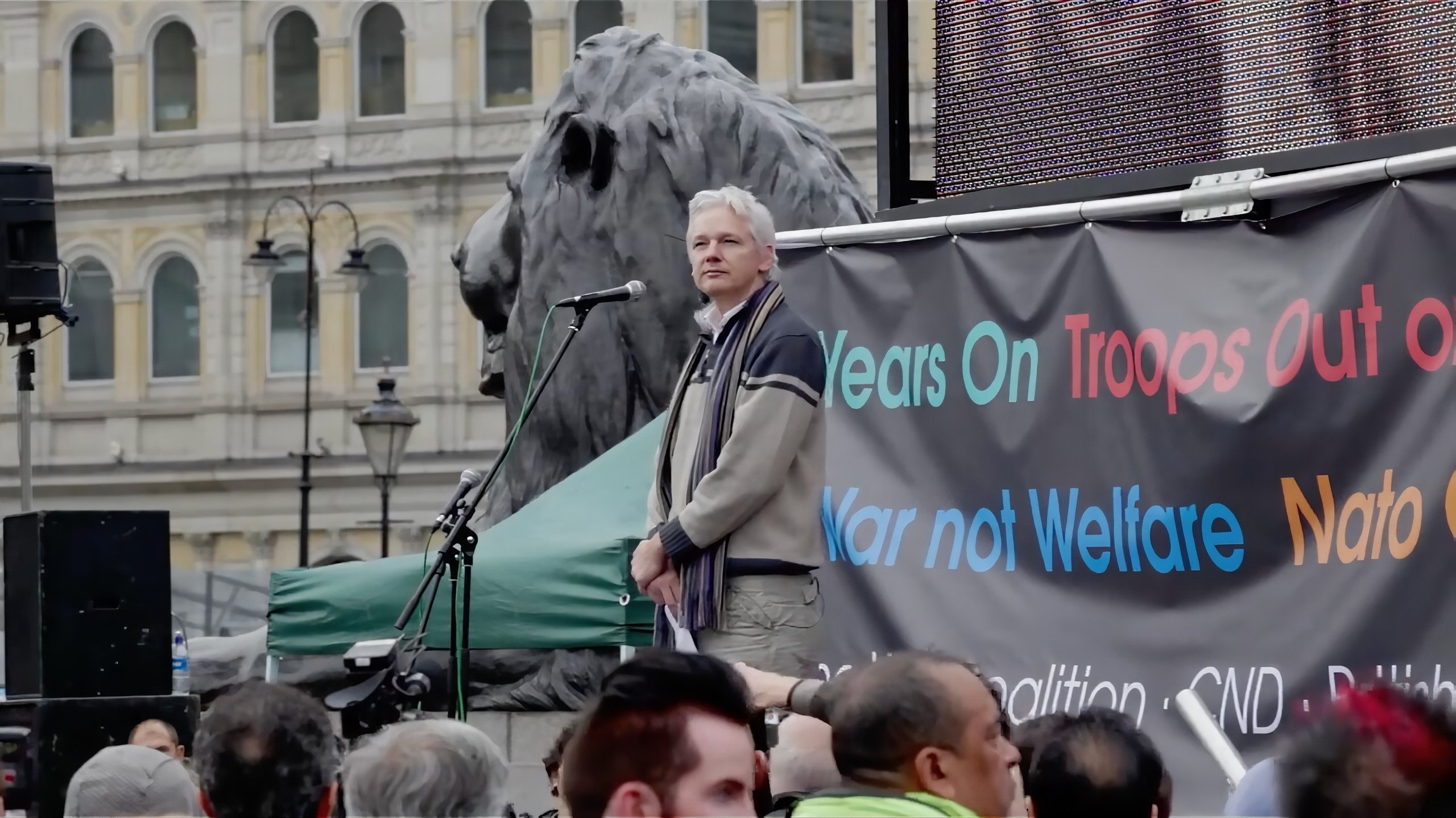 Backdrop for The Trust Fall: Julian Assange