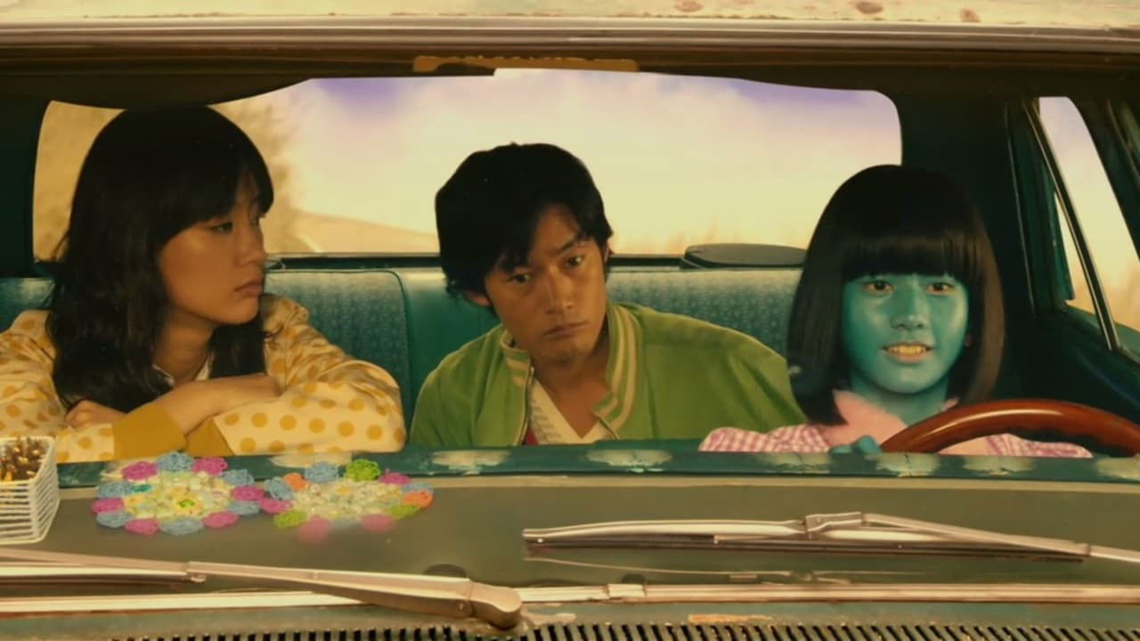 Backdrop for A Honeymoon in Hell: Mr. & Mrs. Oki's Fabulous Trip