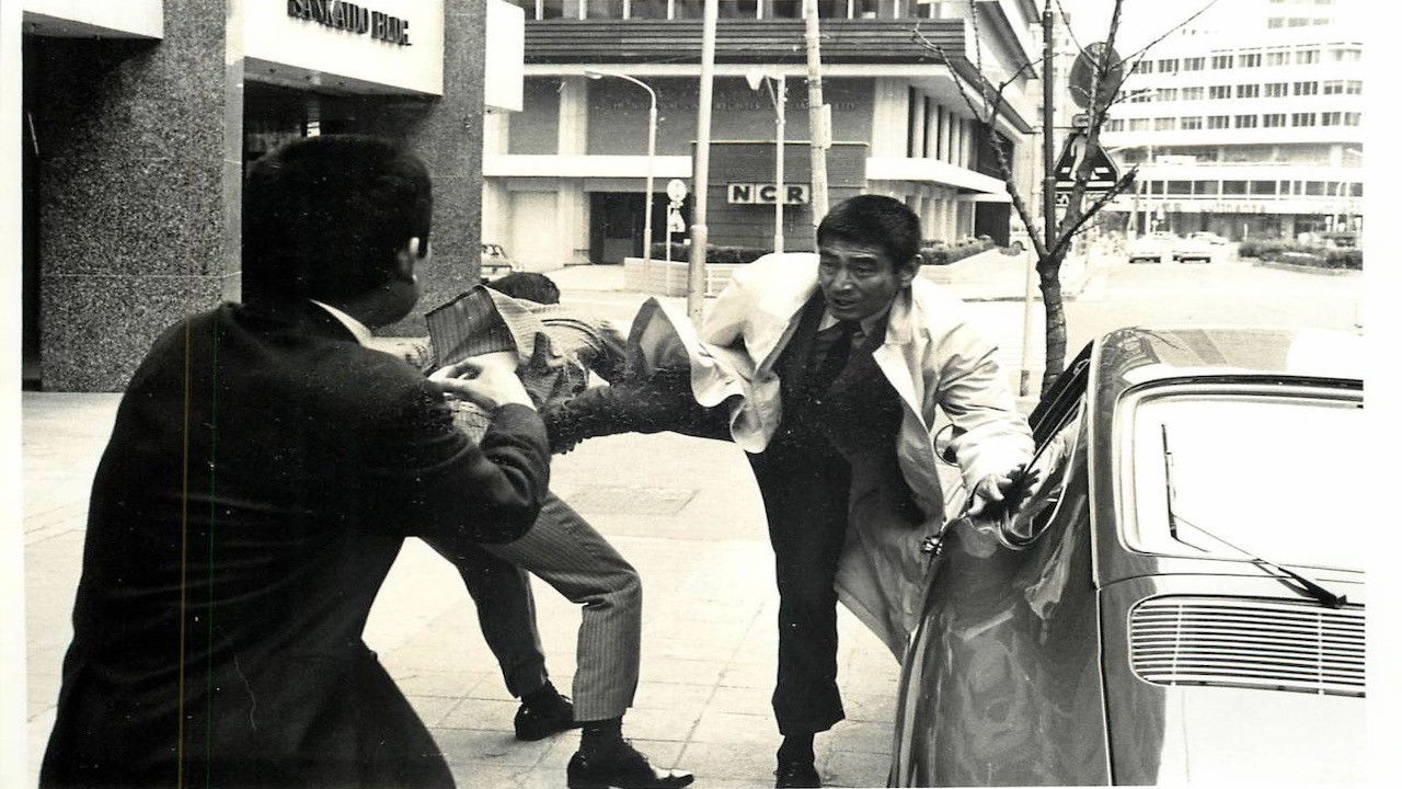 Backdrop for A Hoodlum At The Risk Of His Life