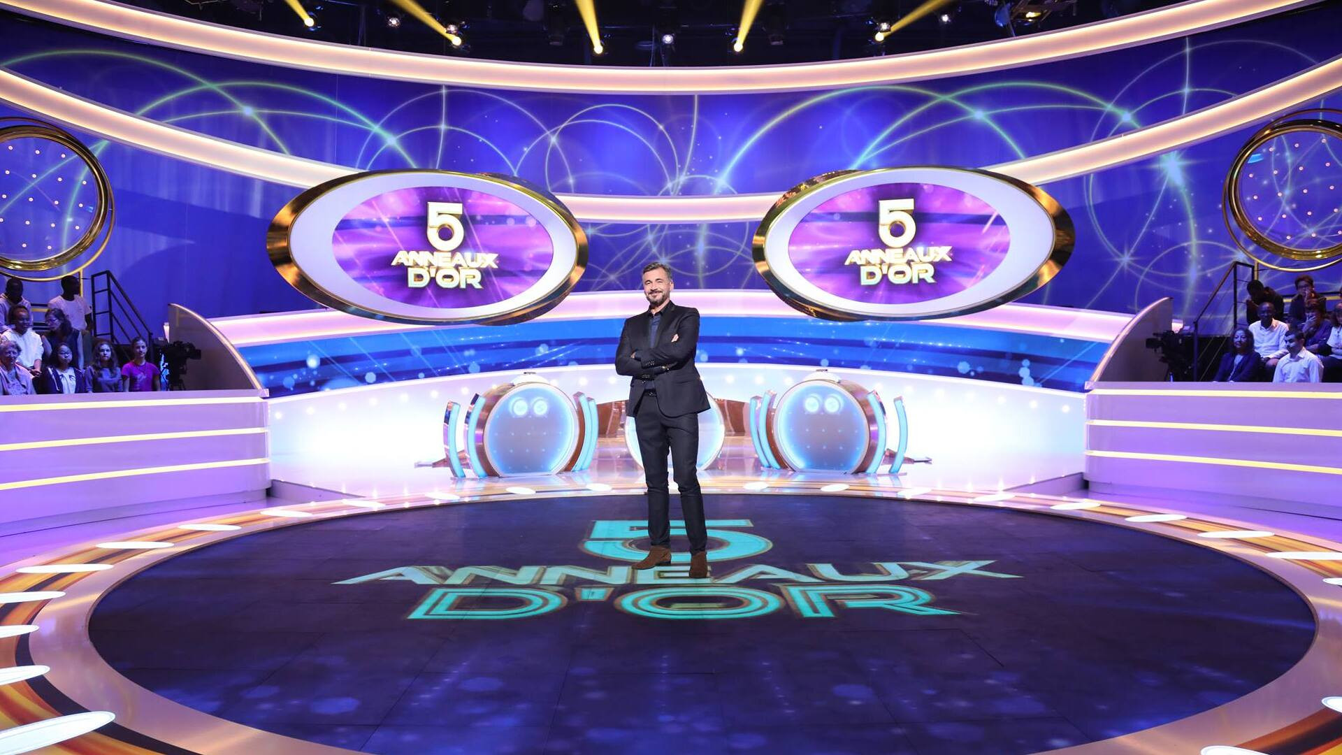 Backdrop for Les 5 Anneaux d'Or