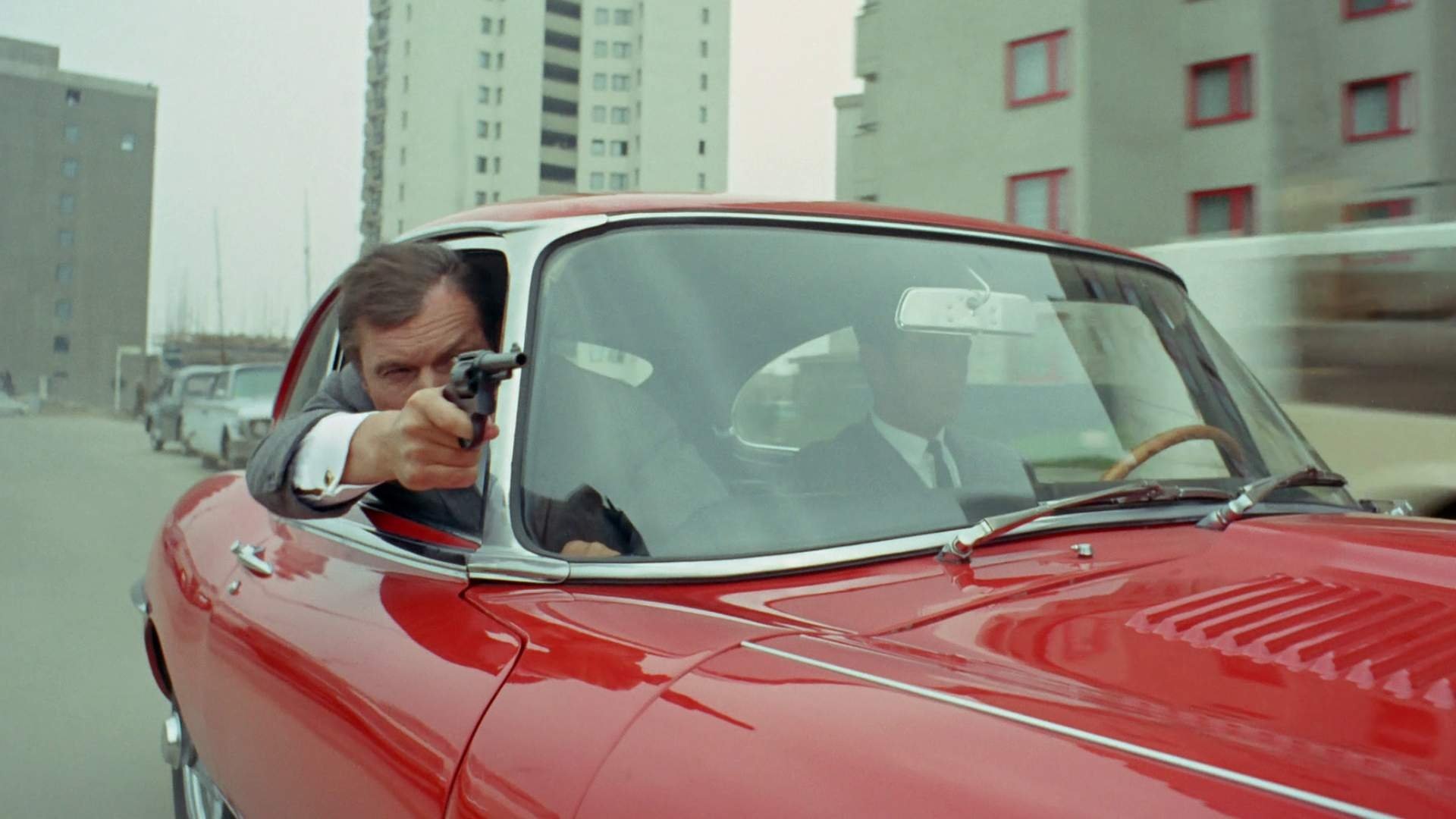 Backdrop for Jerry Cotton: Death in the Red Jaguar