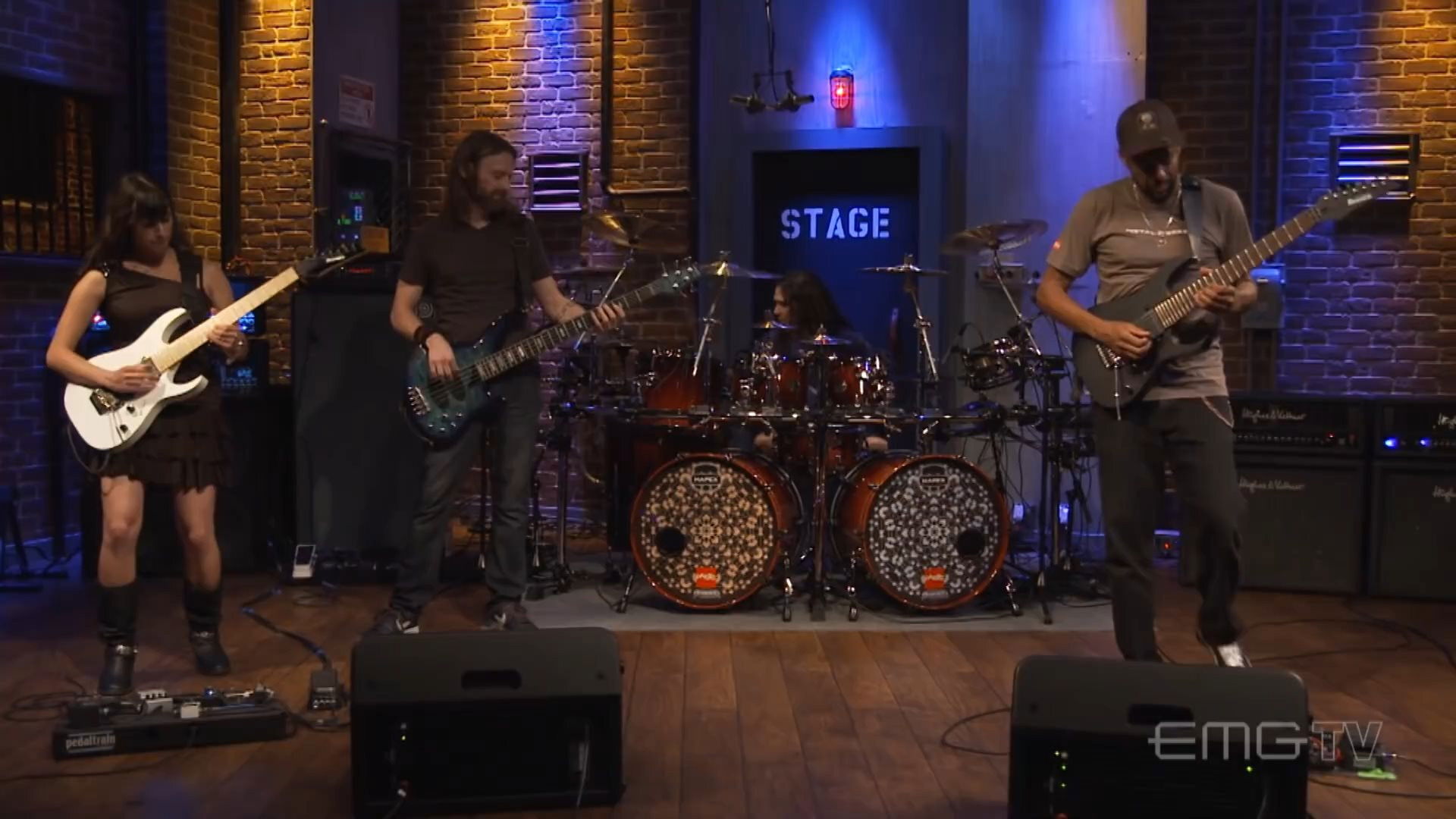 Backdrop for Tony MacAlpine and band perform "Tears of Sahara" on EMGtv