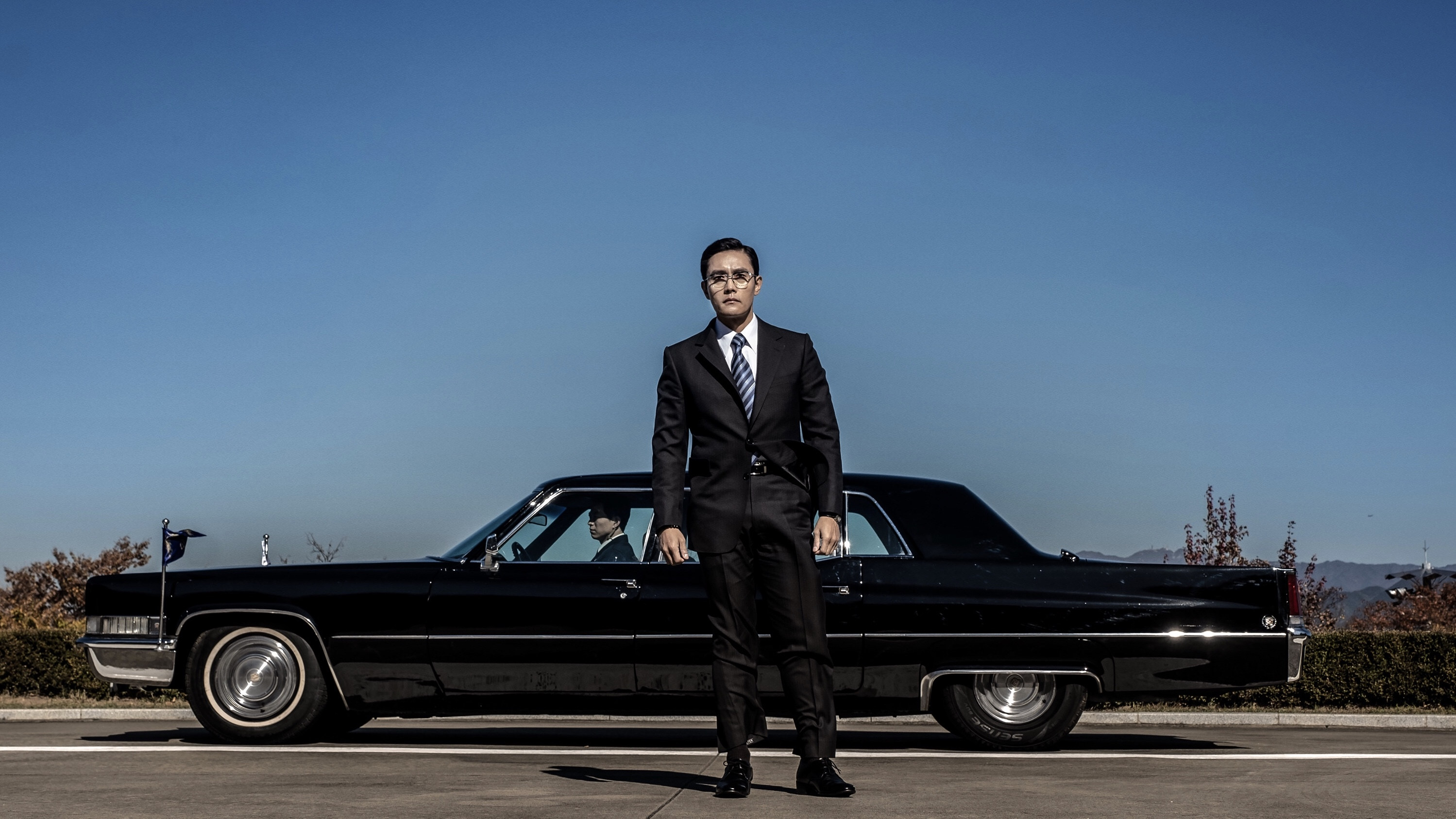 Backdrop for The Man Standing Next