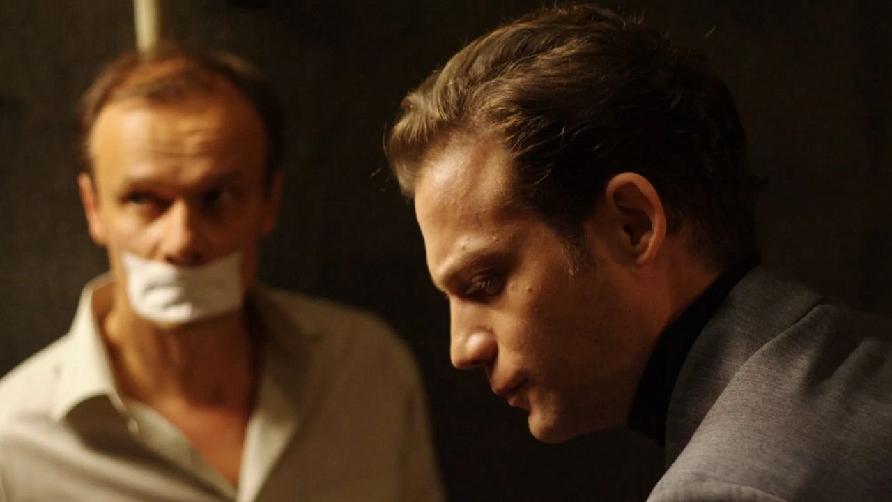 Backdrop for The Debt